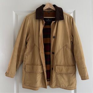 vintage Woolrich women’s canvas chore coat with striped fleece liner